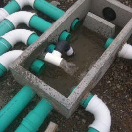 Plumbing of septic drain field in pump up system